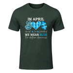 In April We Wear Blue Autism Awareness T-Shirt in Forest Green - front view