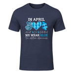 In April We Wear Blue Autism Awareness T-Shirt in Heather Navy - front view
